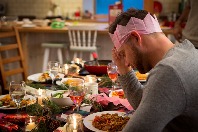 SAD MAN AT CHRISTMAS TABLE