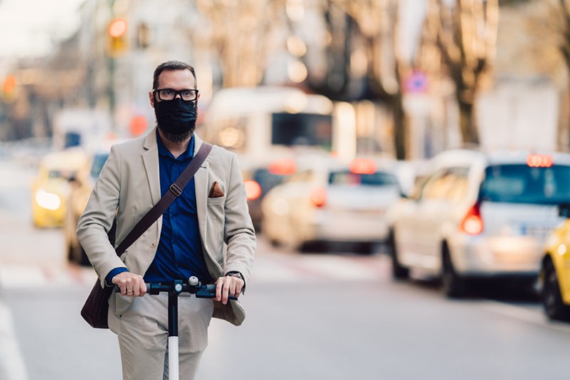 MAN IN TRANSPORT, WEARING A FACE MASK