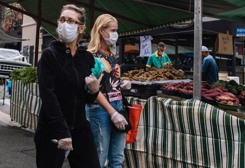 TWO WOMEN WITH FACE MASKS