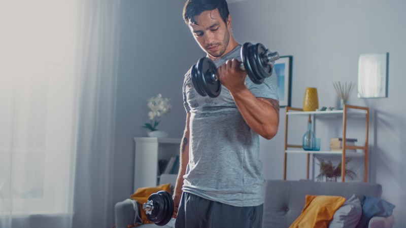 FIT MAN WORKING OUT AT HOME