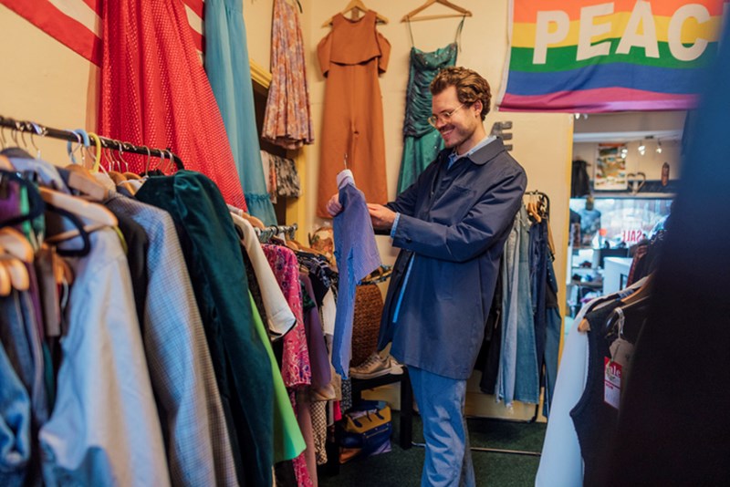 MAN SHOPPING FROM THRIFT STORE