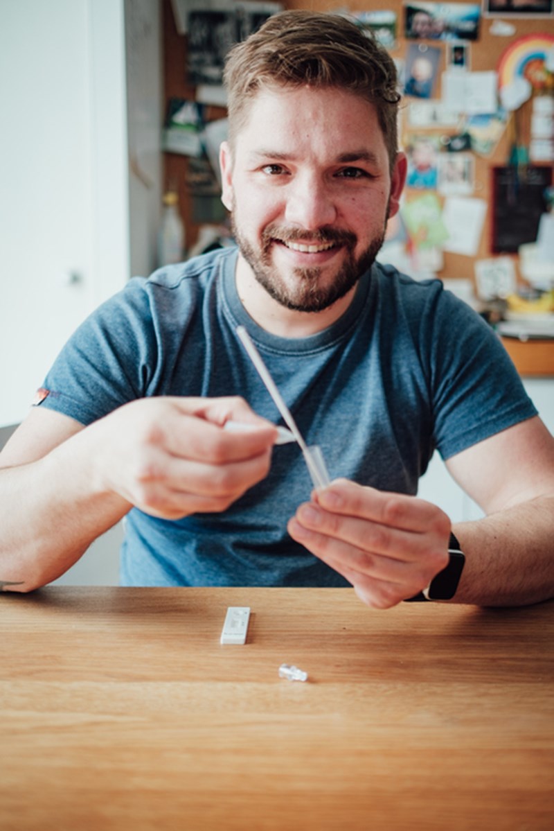 MAN DOING COVID-19 SELFTEST