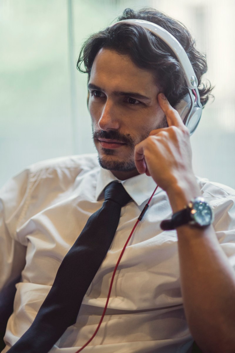 BUSINESMAN LISTENING TO MUSIC
