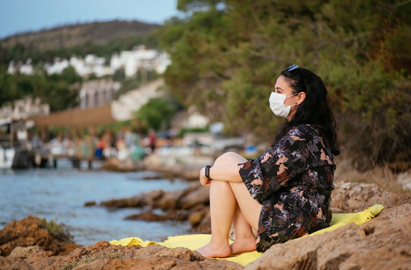 WOMAN WEARING PROTECTION MASK