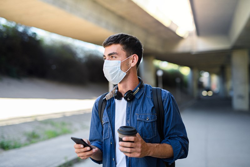 MAN WEARING PROTECTIVE MASK
