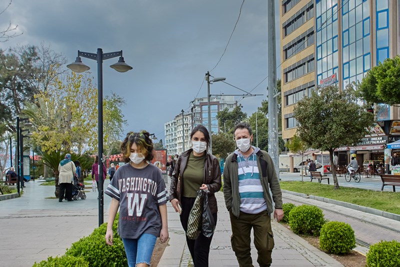 PEOPLE WEARING PROTECTIVE MASKS