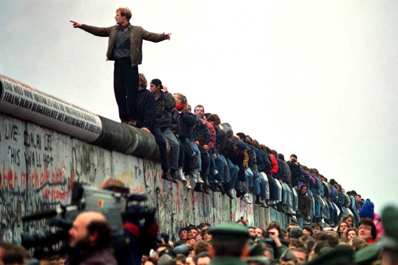 PEOPLE CELEBRATING THE FALL OF BERLIN WALL