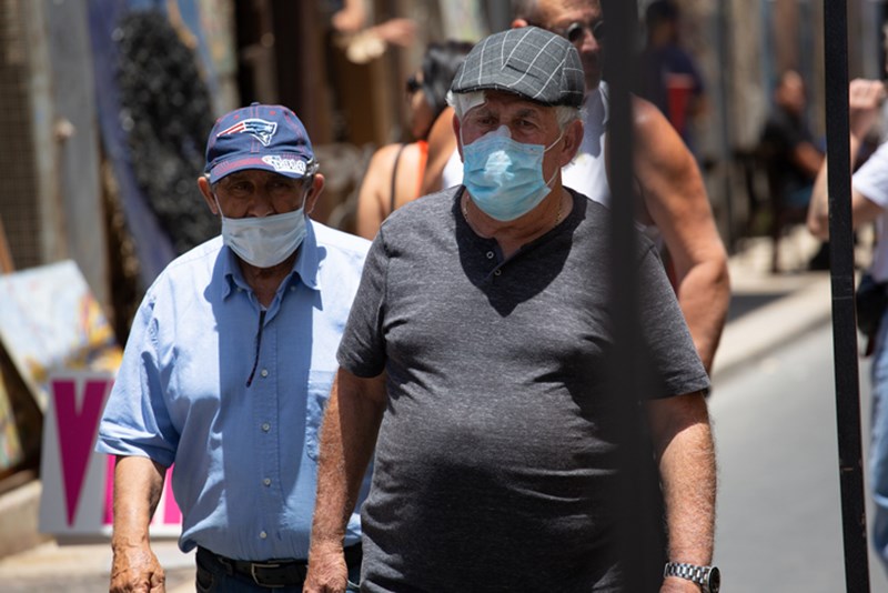 PEOPLE WEARING PROTECTIVE FACE MASKS