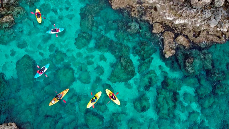 PEOPLE KAYAKING IN THE SEA OF AYIA NAPA, CYPRUS