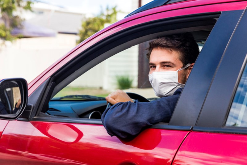 MALE DRIVER WITH PROTECTIVE MASK