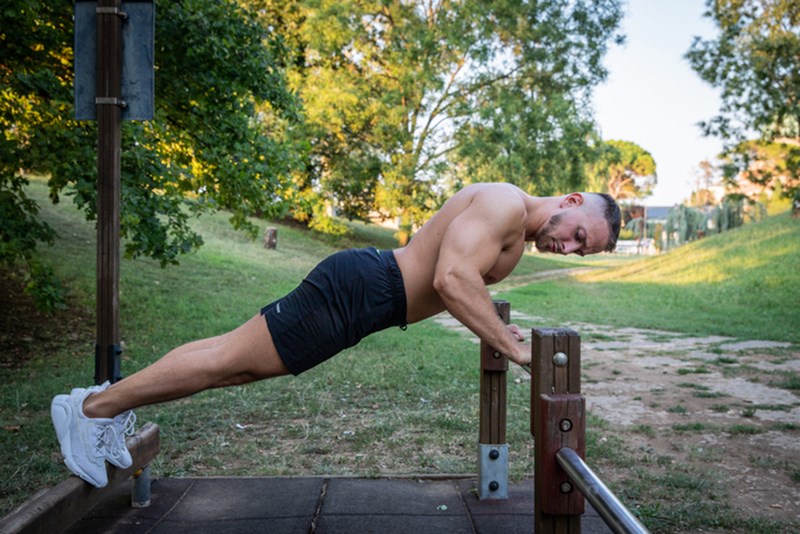 MAN EXERCISING IN A PARK