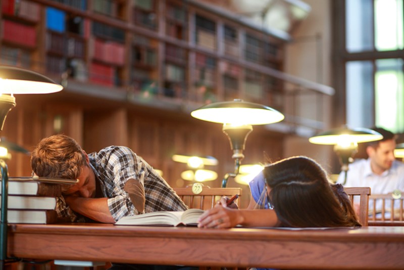PEOPLE SLEEPING IN A LIBRARY