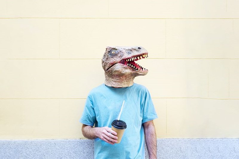 MAN WITH A DINOSAUR MASK