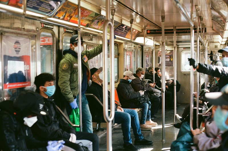 COMMUTERS WITH PROTECTIVE FACE MASKS
